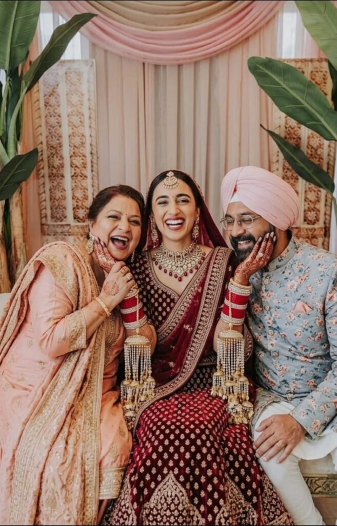 Indian bride celebrating a happy marriage with family
